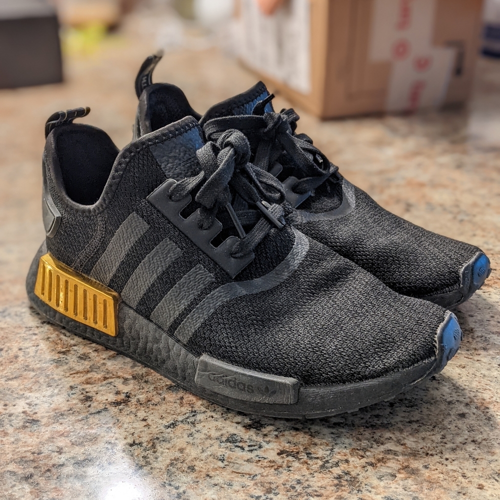 Women's black/gold NMD